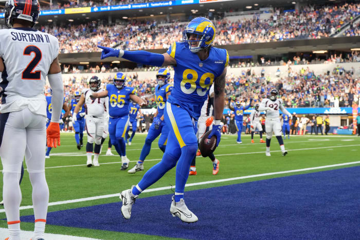 Los Angeles Rams tight end Tyler Higbee (89) celebrates after scoring on a 9-yard touchdown pass against Denver Broncos cornerback Pat Surtain II (2) in the first half at SoFi Stadium.
